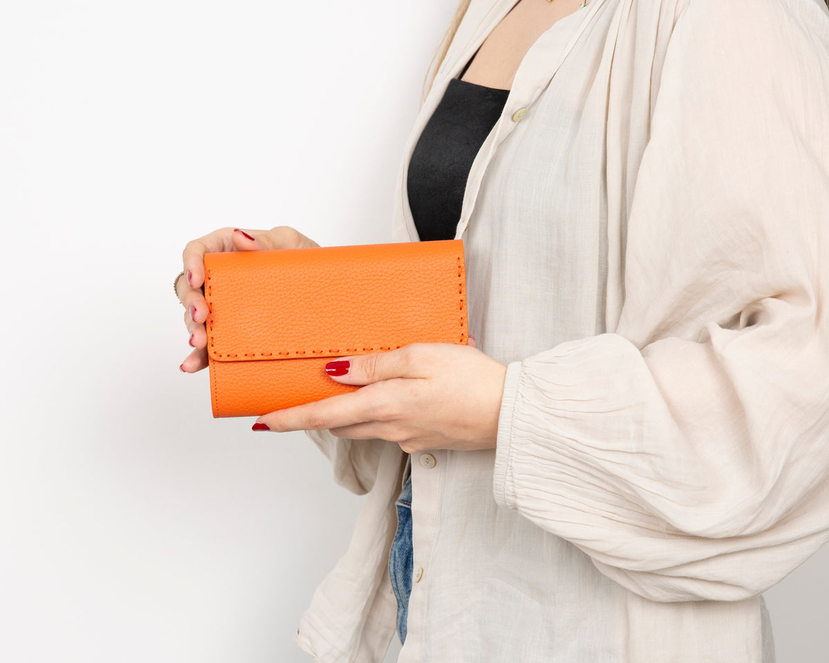 Compact women’s leather wallet with ID windows and full-length bill section