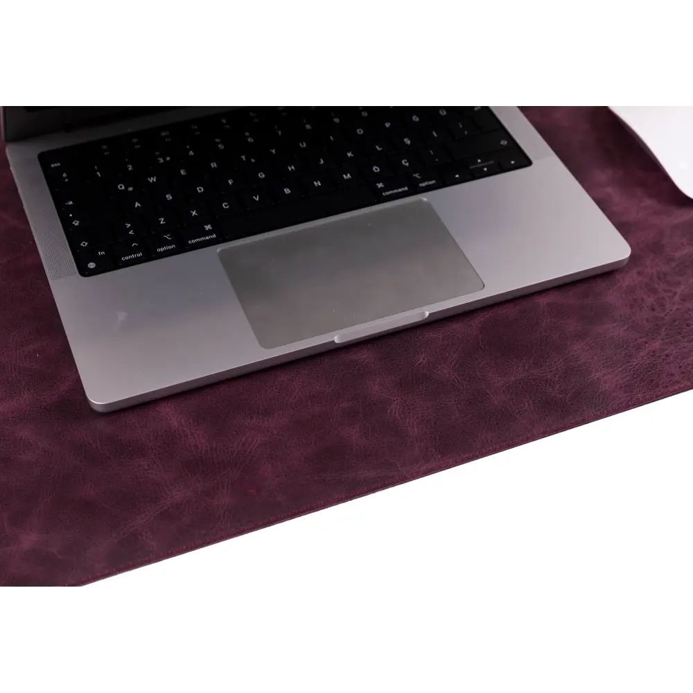 Laptop on a purple surface