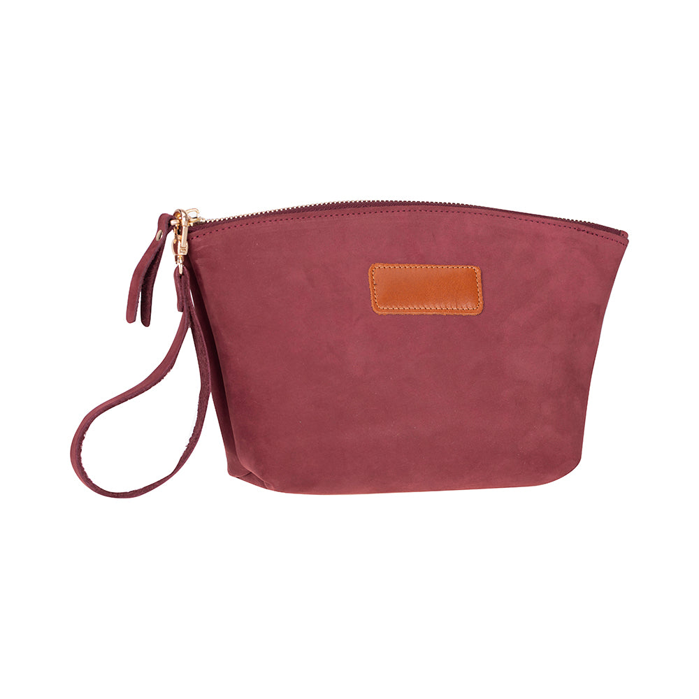 Maroon wristlet with a brown patch on a white background