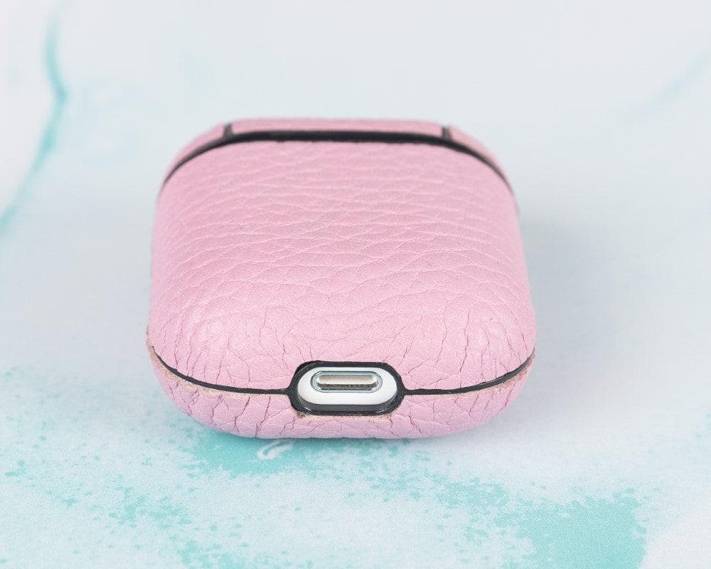 Pink textured electronic case with charging port on a light blue background