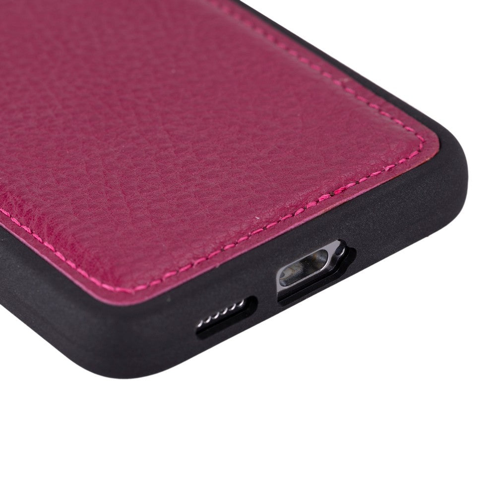 Close-up of a phone case with pink and black design on a white background