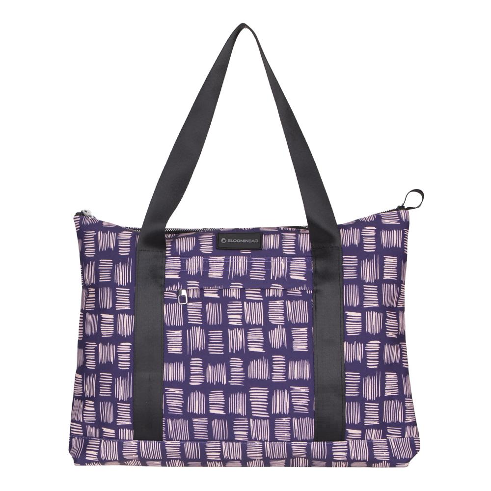 Purple patterned tote bag with black straps on a white background