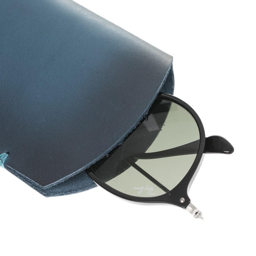 A navy blue genuine leather eyewear case with a pair of sunglasses partially inserted, highlighting the case's capacity and style.