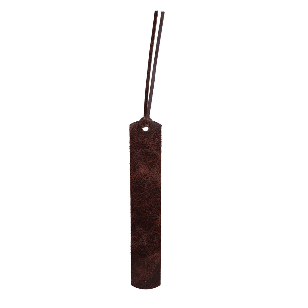 Brown leather bookmark with a pattern on a white background