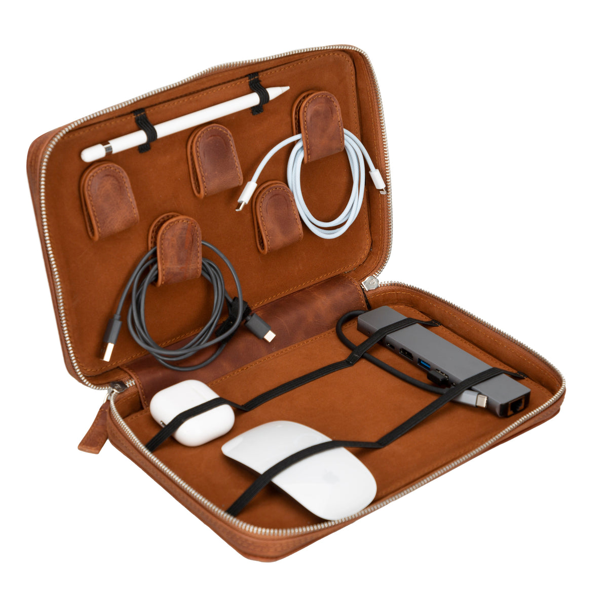 A brown genuine leather cable organizer case open, displaying an organized arrangement of cables, pens, and a white mouse.