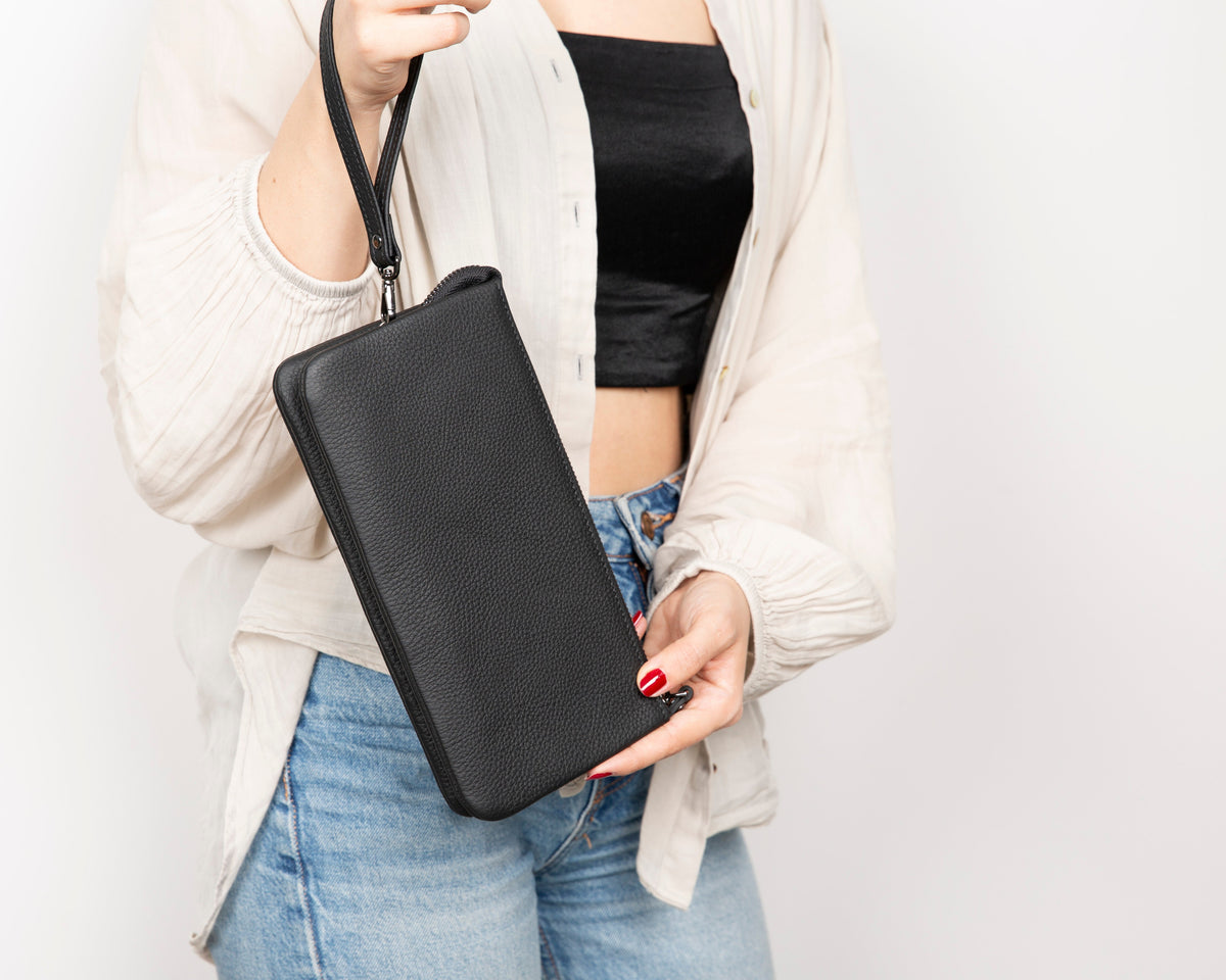 Handmade leather clutch with multiple inner compartments for organization