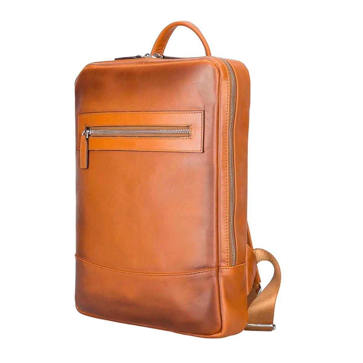 A warm cognac brown leather backpack shown from a three-quarter angle against a solid white background, featuring a top handle, a front zippered pocket, and a detachable shoulder strap.