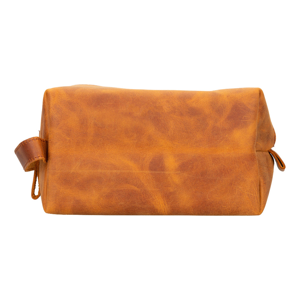 Brown leather dopp kit on a white background