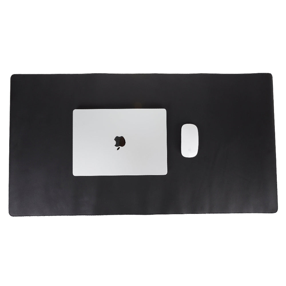Black desk mat with a laptop and mouse on a white background