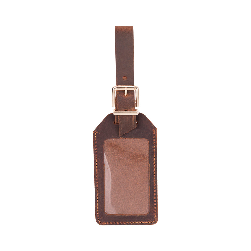 Brown leather luggage tag with a strap on a white background