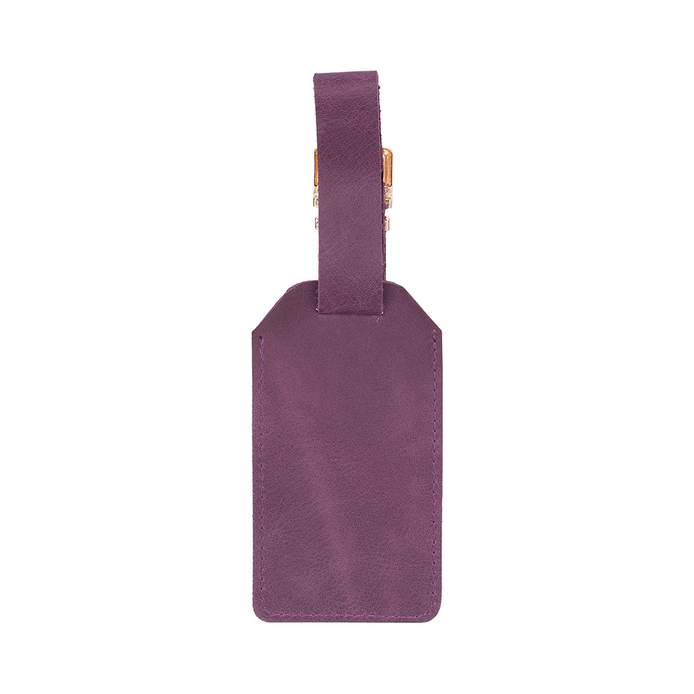 Purple leather luggage tag on a white background