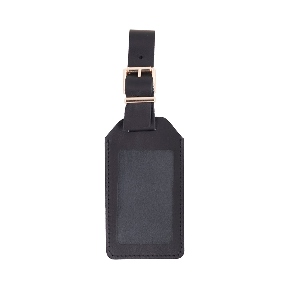 Black leather luggage tag with rose gold buckle on a white background