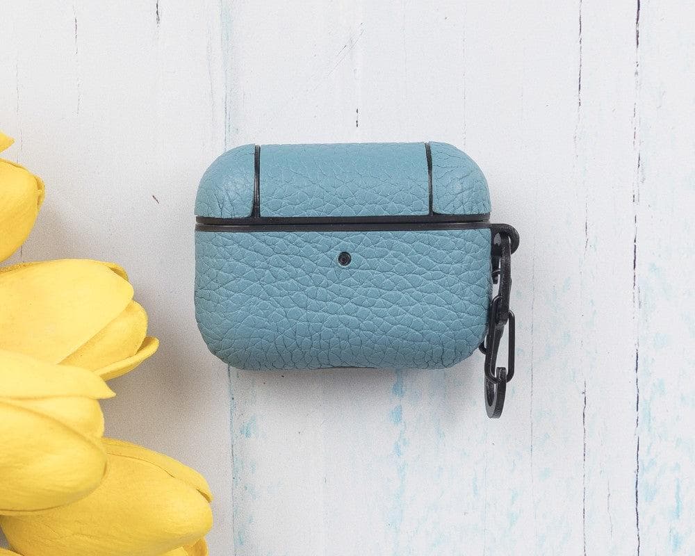 Blue textured phone case with black strap on a light wooden surface