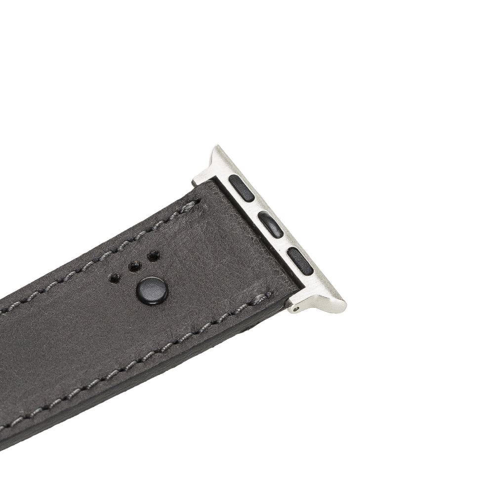 Gray watch strap with metal buckle on a white background