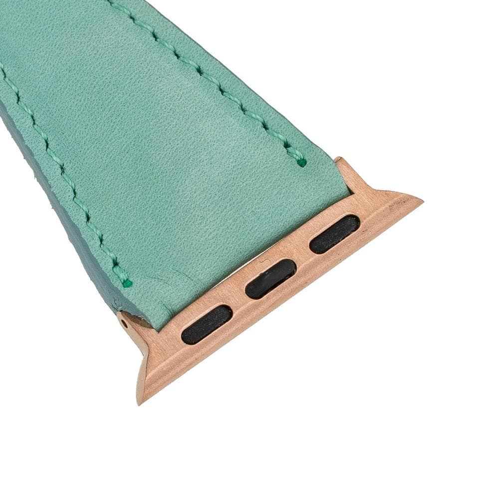 Teal watch strap with gold metal clasp on a white background