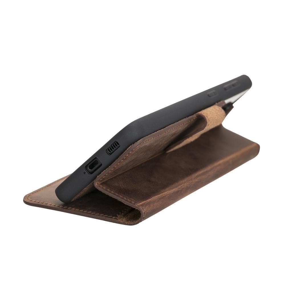 Brown leather phone case with black phone inside on a white background