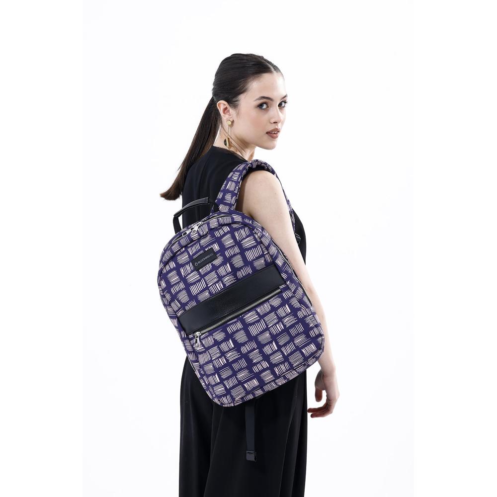 Woman wearing a purple backpack with geometric pattern on a white background